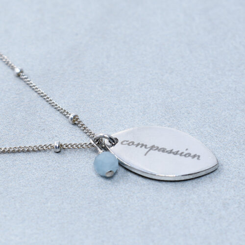 silver daisy compassion necklace